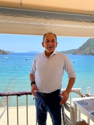 Our happy, friednly restaurant owner in Tolo - every Greek person we met were delightful.  So happy to see us.