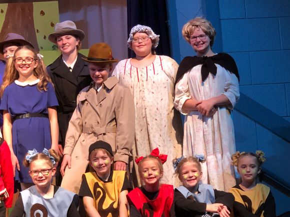 Little Evie, far right on the floor, love to tease her grandpa endlessly. Chloe, far right standing with the black tie around shawl, has nervous quirks but is flawless in the play.