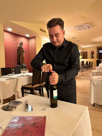 Oh how I tried to stifle a laugh as he struggled with opening the wine.....cork broke into pieces but he persisted!