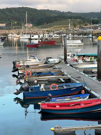 Fishing boats in the harbor, where there is also a sandy beach where kids were swimming in the very chilly sea.