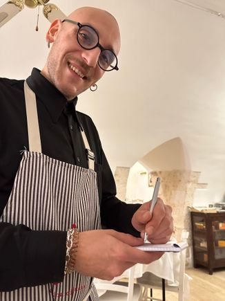 Our cute waiter taking the order; English is spoken here, but not fluently