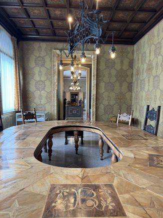 I think we scanned a QR code for the audio tour of the house. I don't remember why this table has a hole in the middle. 