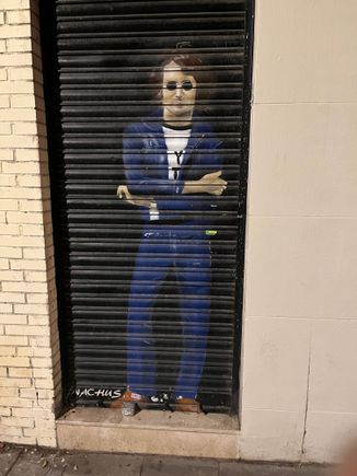 John Lennon mural painted on garage door. 
