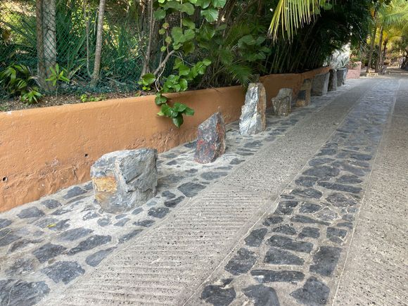 Look at these fancy rocks...are they ancient Mayan ruins, some mystical stones from Stonehenge?  No, just an effective way to say "NO Parking"