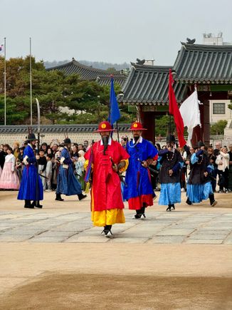 Actors reenact the changing of the guard twice daily 