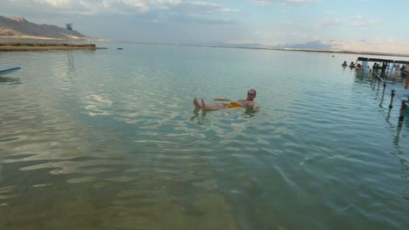 Floating in the Dead Sea. You can't sink unless you have cement shoes on. :D. 