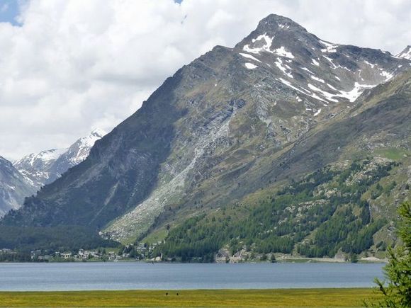 2 people walking in meadow  - for scale 
