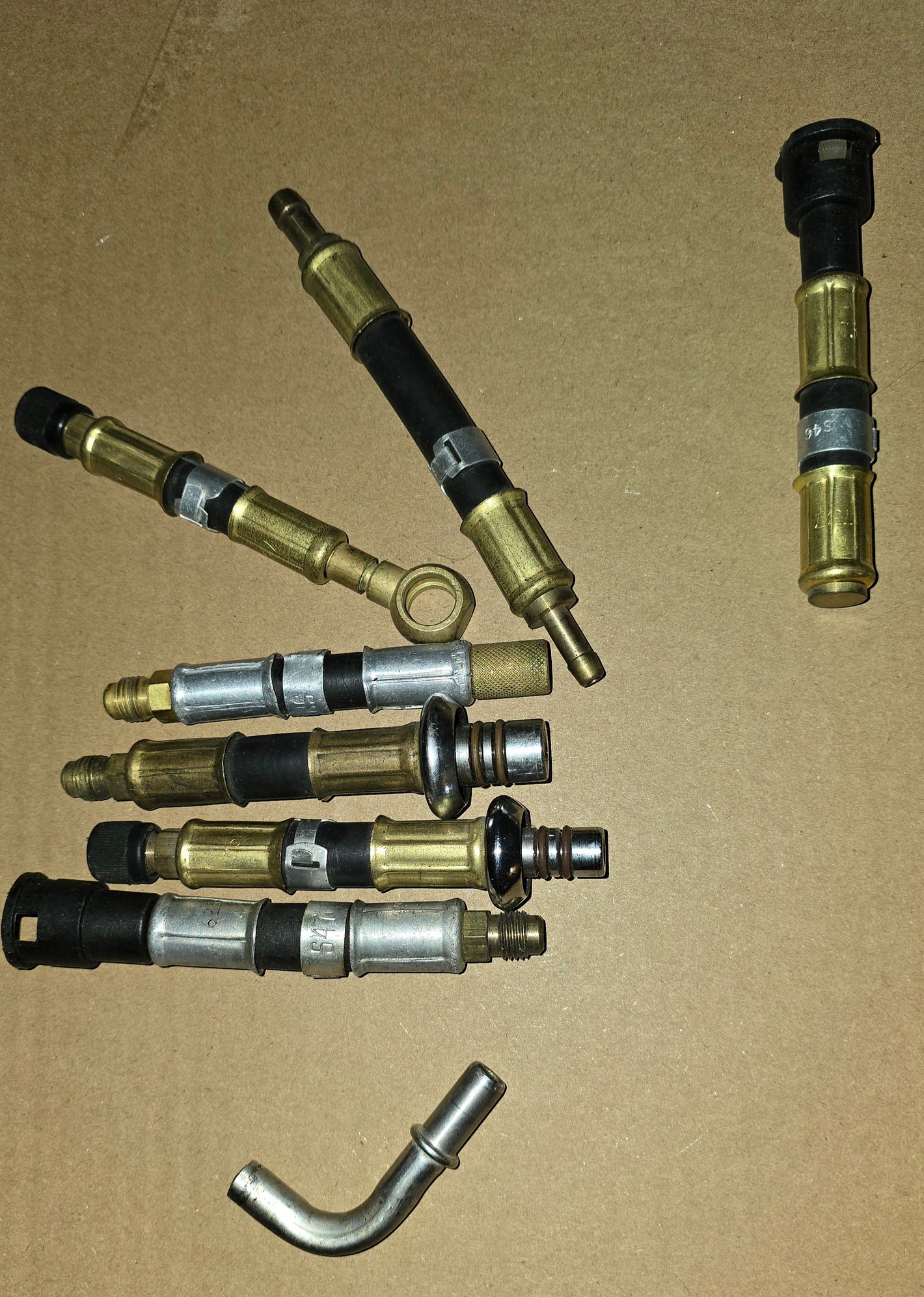 The one on the far right is a return fuel line block off tool.