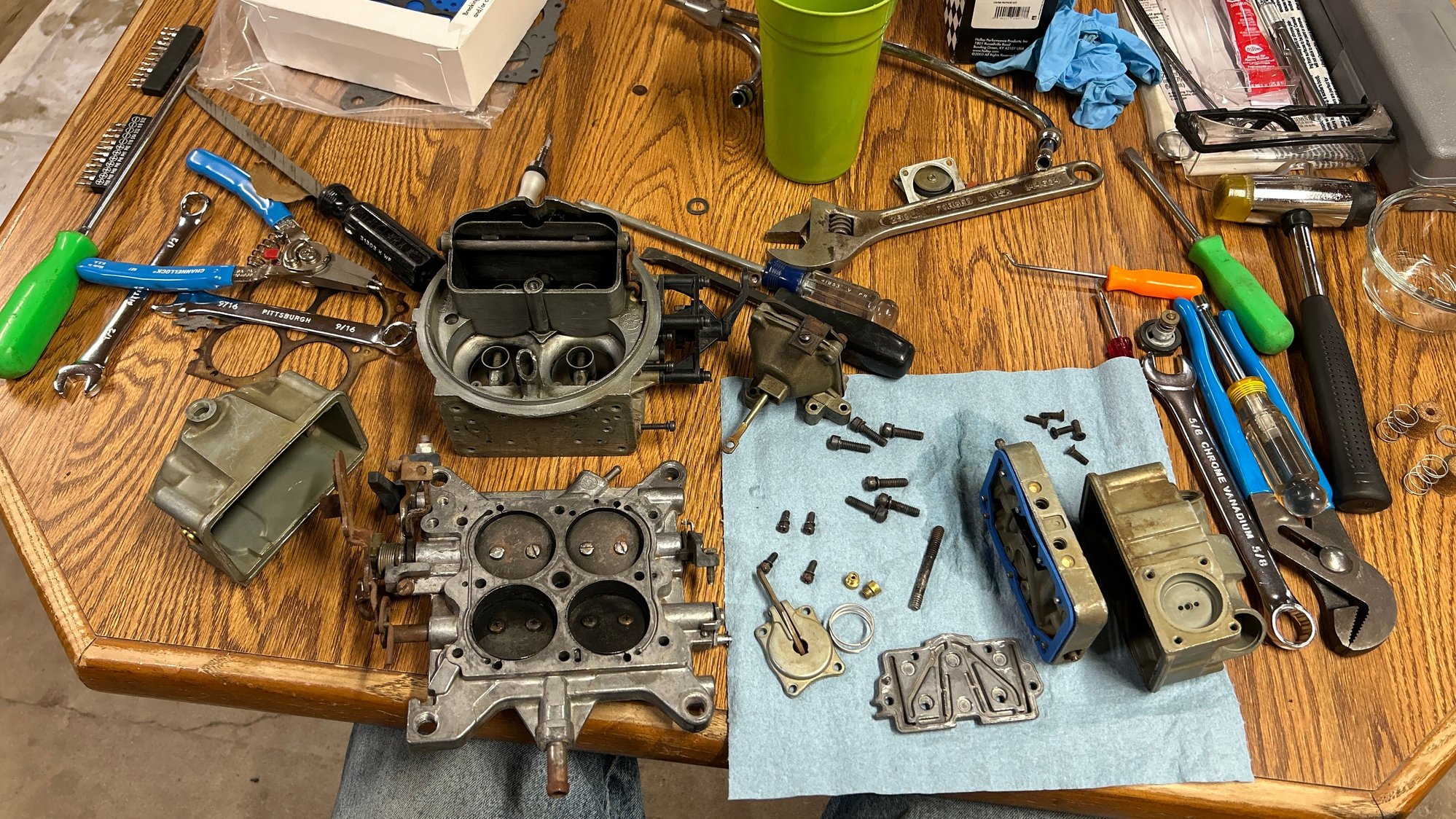 So I had the carburetor all tore apart. It went through a few cycles of the ultrasonic cleaner because I couldn�t fit it all in one go. And the bottom plate was just a little bit too big and it stuck up out of the solution so I had to flip it and then run it againwith a few other parts so it�s an old crusty carburetor, but it should work just fine. Throttle blades are a little bit rusty, and it took a while to get all the black carbon out of it. I didn�t get all of it, but I got most of it. 