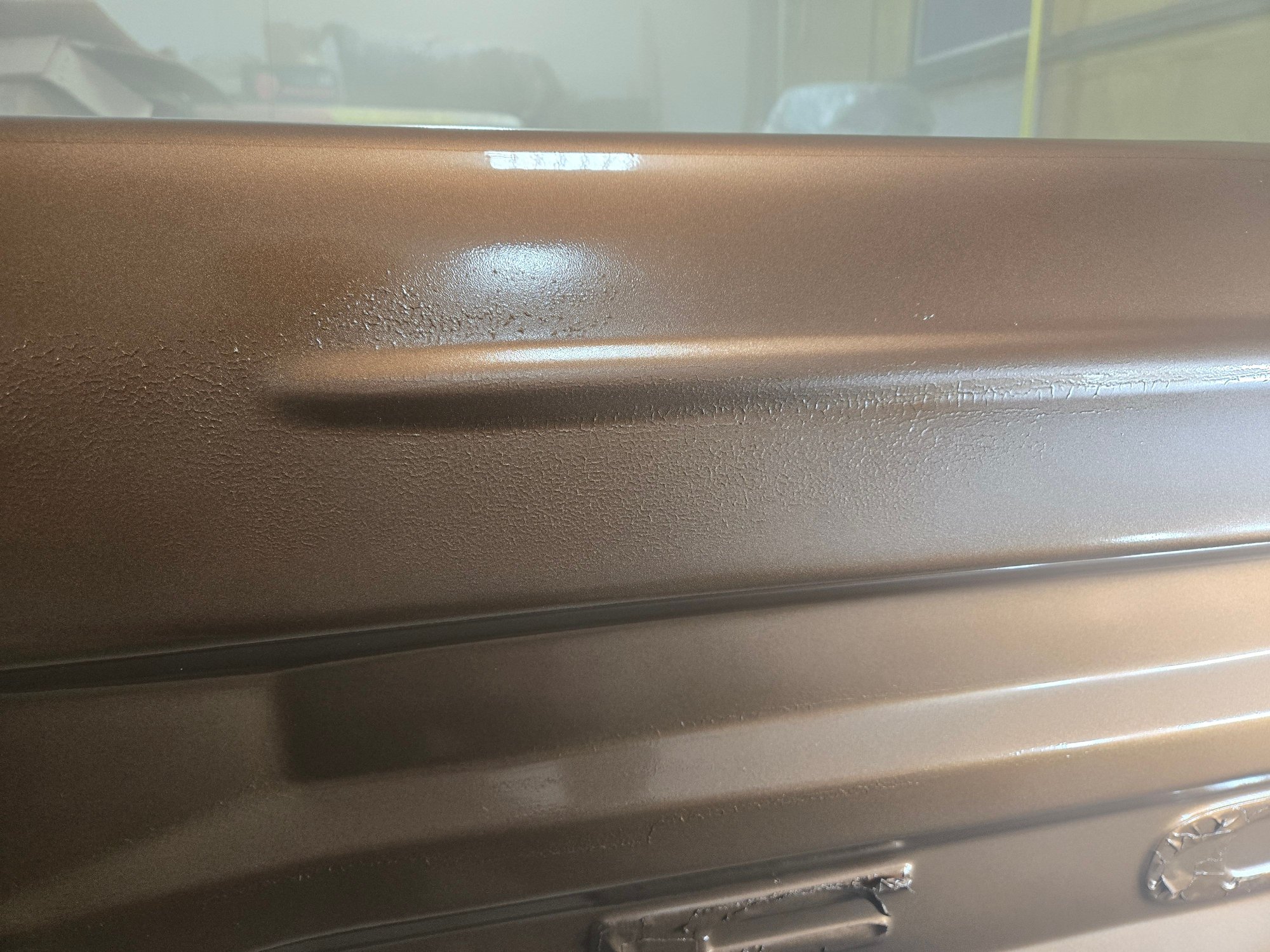 I'm guessing that i have some contaminant on there, but what it is and how do i get rid of it?  I fairly bummed out, as this was the last piece i had to paint, and now im out of my base color, so I'll have to buy more just for the tailgate.....