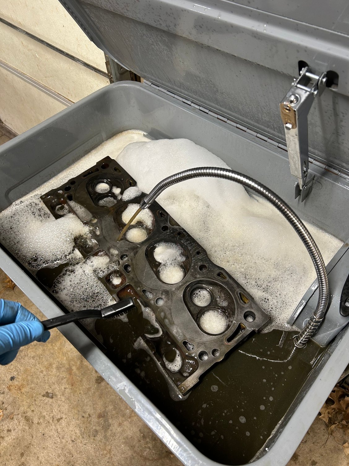 I went ahead and grabbed some of the harbor freight degreaser and I�ve heard good and bad reviews on it. I figured I�d just check and see myself and it didn�t work too bad. Normally I use super clean and I still think super clean is probably better, but I was impressed with a little elbow grease The harbor. Freight degreaser worked fairly well and it got quite a bit of that black burnt on carbon out of the exhaust ports and the chambers.