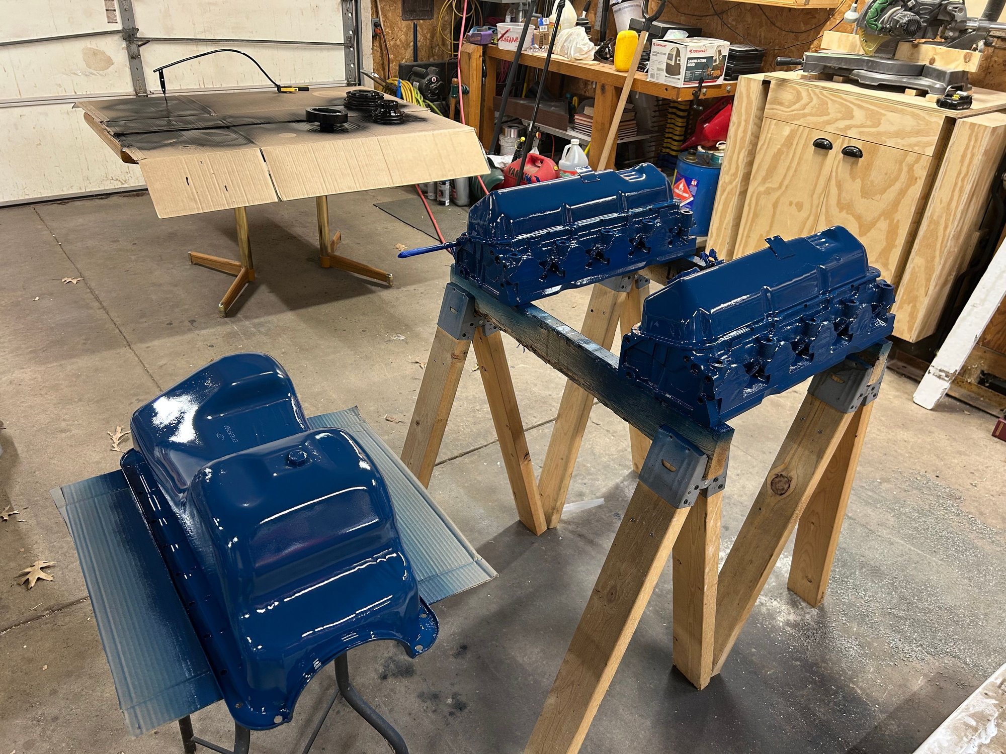 Just threw the valve covers right on top of the heads. That way I didn�t need to tape the tops off. I had separated the parts into the different colors I was doing. I was hoping I didn�t get any overspray from one color to another on the different parts. I think I had them separated far enough anyways we�re gonna go with it.