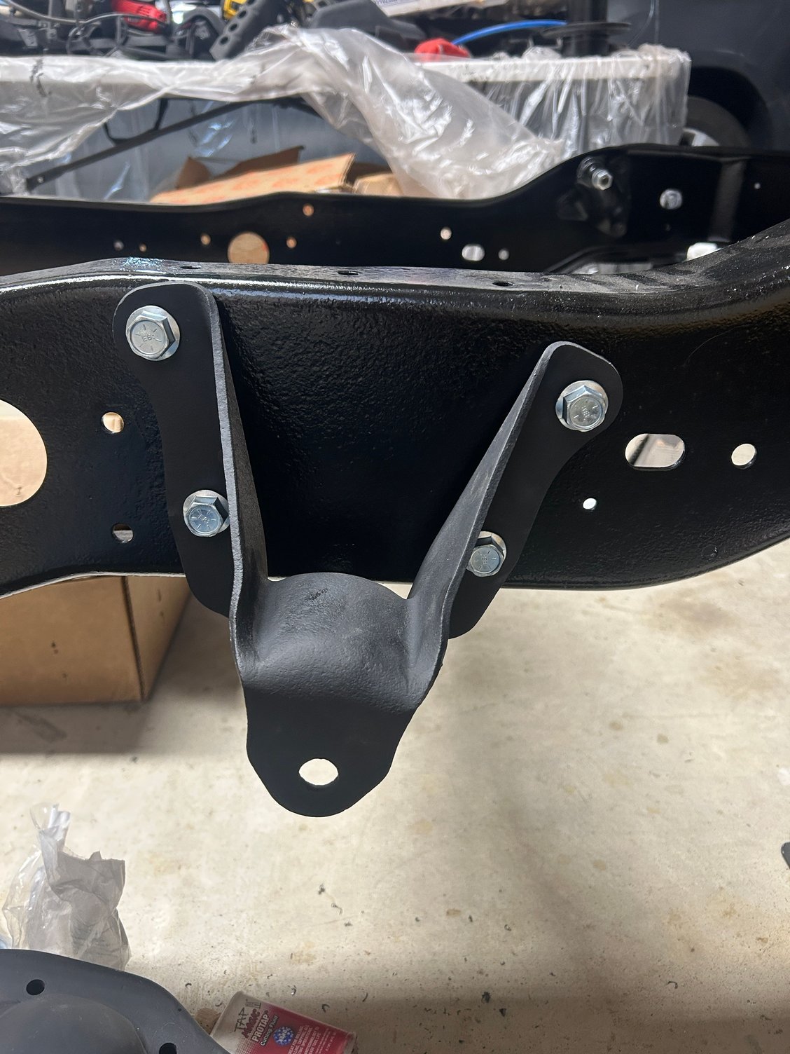 Lower holes on the leaf spring hanger were a bit small, only had to drill the bottom two out.