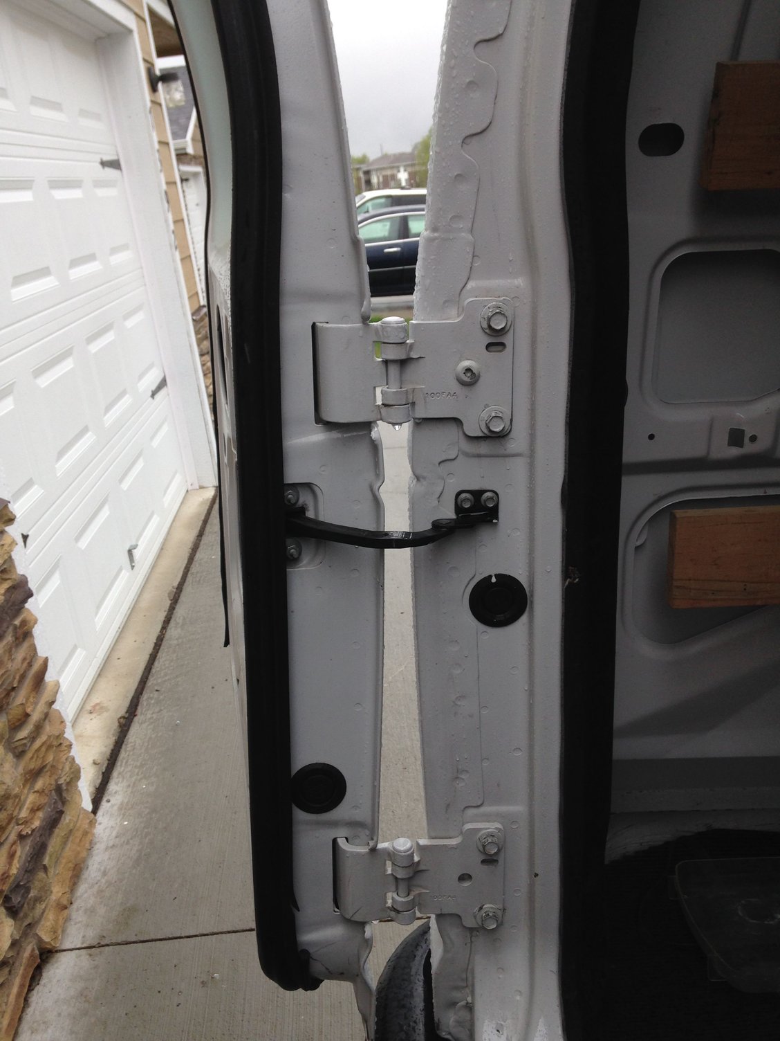 How do I adjust the rear doors on a E250 Cargo Van Ford Truck