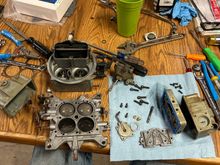 So I had the carburetor all tore apart. It went through a few cycles of the ultrasonic cleaner because I couldn’t fit it all in one go. And the bottom plate was just a little bit too big and it stuck up out of the solution so I had to flip it and then run it againwith a few other parts so it’s an old crusty carburetor, but it should work just fine. Throttle blades are a little bit rusty, and it took a while to get all the black carbon out of it. I didn’t get all of it, but I got most of it. 