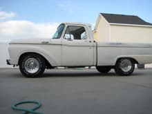 1964 Ford F100  - 223ci mileage maker - 3 speed on the floor with a Hurst Shifter - lowered with mono leaf suspension - 15 x8 aluminum wheels with 235/75/15 tires