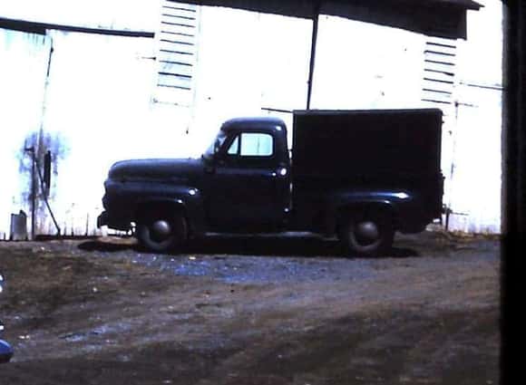 This is a closeup and cropped pic of the previous one. I do not remember ever seeing those high sideboards on the truck. Grandpa must have been hauling cattle.