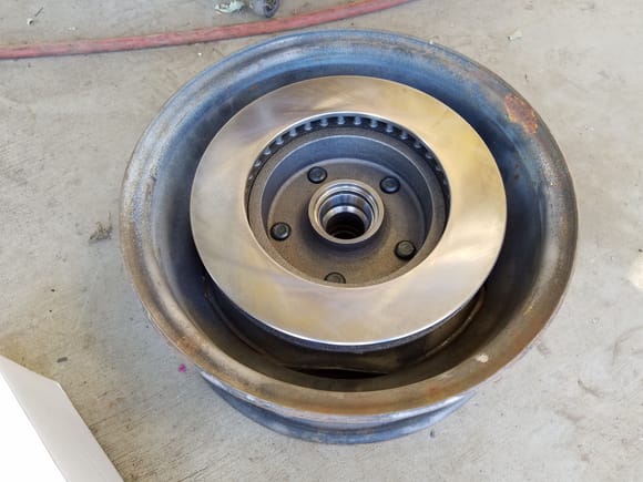 Plenty of clearance for the new rotors. After I bought it, I read the warning, "May have clearance issues with stock rims."