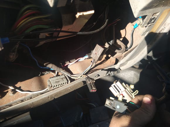 Follow the wires down from the clock spring down to underneath the dash and remove your under pannel. 