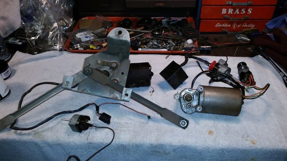 Here's tge old '66 parts on the left and the new parts on the right.  I could have used the 66 wiper motor, but I used the newer one for the simple addition of the bullet connector for power.