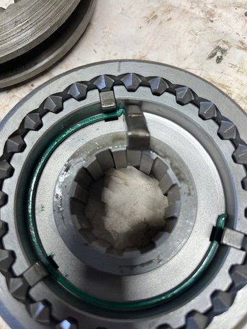 Photo shows the difference in width of the Inserts between the old version (wider) and the updated version, installed in the hub.