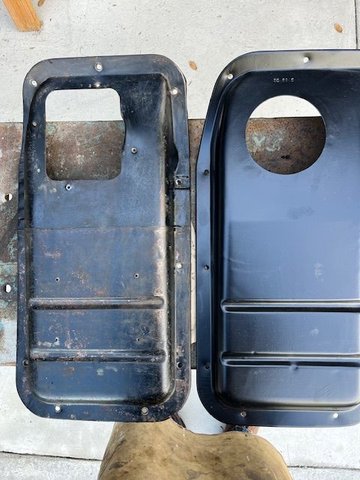 The '66 transmission cover on the left, '65 on the right.Notice the absence of screw holes around the circular opening on the right.