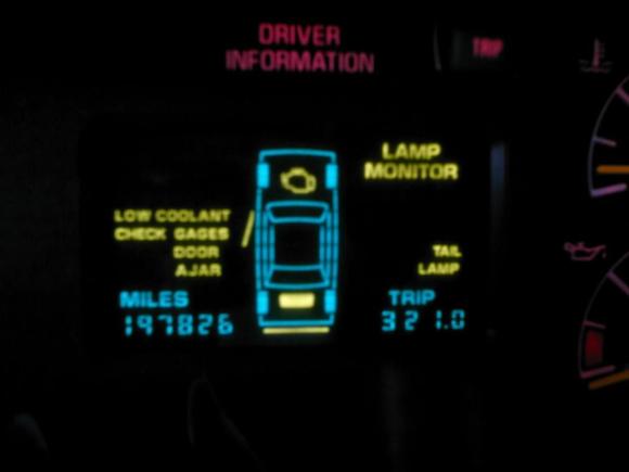 can anyone help me with why my messages center says burned out trail light (i replaced it) and it still displays tail light????????  please don't mind the low coolant light I have a little leak in the raditor.
