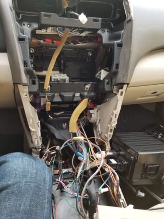 Here's the whole harness opened up, the sleeve cut up and wires separated. I was trying to trace my Aux wires as the it wouldn't work when pressed the button.