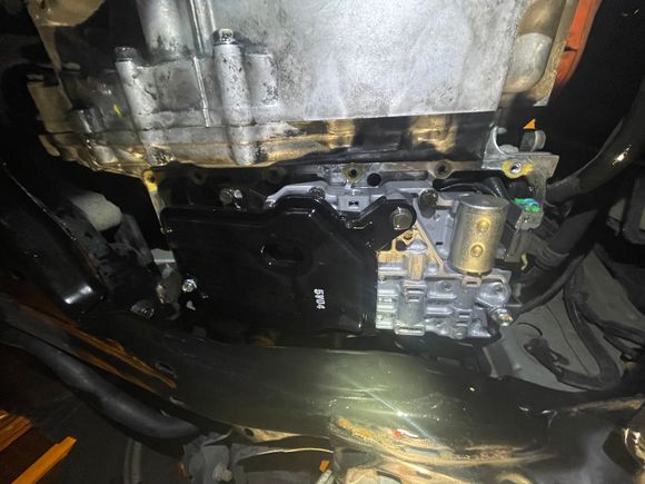 What it looks like when the pan is dropped. the black thing is the CVTF strainer, the rest is the lower valve body.