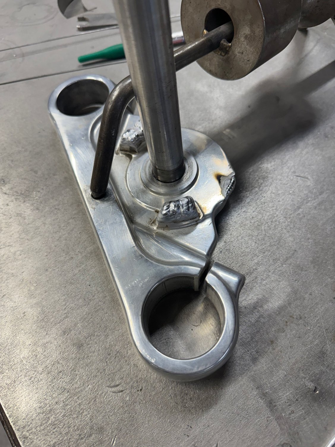 Cut off the fork lock tab and added some weld to make the fork stops taller so they engaged with the frame properly