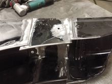 Close up of the donor piece side skirts slipped inside the stock fender.