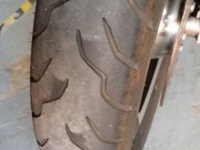 31k on a Dunlop AE, minor cupping never bothered me in almost 120k miles on my 09 Ultra, 95% heavily loaded two up