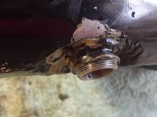 Used tank at local V-Twin parts store didn't last long. Sprung a leak. When i investigated it, this is what i found. A 'J-B' weld patch attempt on a leaking fitting. Now i know why i got such a good deal on it.
