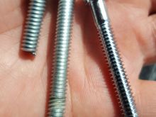 So the one on tge left is the broken bolt. The one in the middle is the one harley davidson gave me but its 2 inches...a quarter to long. The one on the right is the right length, 1 3/4. But my only concern is its not threaded all the way. Idk if itll fit properly. Only way to find out is to get that broken off bolt out first!