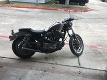 The tank and fender is bare metal with some clear coat.