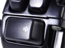 These controls are poorly marked. I’ll give you that. Inner is start button. Outer is kill engine button. If you hit it accidentally, just put it in correct position. If moving the engine will restart. If stopped hit start. 
