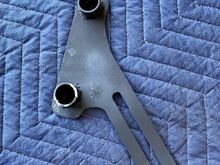 Bracket was painted flat black (still reeks of aerosol spray paint) then while the paint was wet it was wrapped in tissue paper and thrown in the bottom of the box for shipping. 