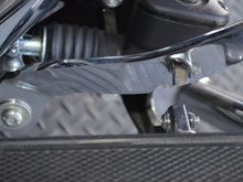 Notch in pedal arm to clear foot pad arm.