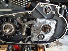 Behind the clutch basket. Its not very difficult. But 1 good thing to know is that the nut for either the clutch basket or stator is reverse thread. I forget which one now. I put block of wood between the chain and sprocket to keep it locked down instead of spinning the motor. Use lock tite. (Made that mistake once lol). Clock the star right and put that c clap back on it. Then CLICK THROUGH ALL THE GEARS AND MAKE SURE ITS CLOCKED RIGHT BEFORE PUTTING IT TOGETHER. Made that mistake once too lol