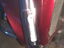 The plastic housing sticks out through the metal cover by about 1/8" or so, plus it's flush with the metal cover all the way around.  A smashed bead of silicone seals the plastic to the tubing all the way around, the metal cover just holds everything in place.