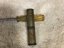 So, any of y'all old-timers recognize this? It's a home-made bullet luber. There is a nail between the two shells that runs through the primer holes. A flat piece the diameter of the bullet is silver soldered to the end of the nail inside the top shell. Bullet wax is melted into a container and bullets placed into the wax. When the wax solidifies this tool is pushed down over a bullet, the bottom shell is pulled apart from the top which creates a vacuum and pulls the bullet from the wax.