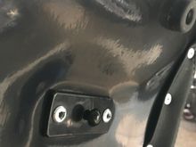 Pin at rear of seat
