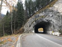 ... the tunnel... this road is built on the old railroad bed... hence the rough looking hole in the wall... when they moved the railway to the other side of the Elk River, the use the bed for the new vehcile road... if you wonder whey the road is so flat for about 20 miles, that is why...