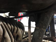 See the little bracket, you need that to hold the throttle cable housing to allow the inside cable move. It is held on by the tank bolt.