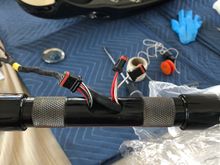 I ran the switch wires from the bottom through the handles. That way the small switch ends that fit into the switches go through more easily.