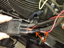 Soldered the red wire to the main battery cable just behind the main fuse which is located under the left side cover.  This is the power to the relay located under my seat.