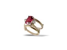 Red Spinel and diamonds set in yellow and white gold.

?;^)