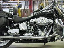 Kuryakyn adjustable passenger pegs, deluxe foot boards, custom back rest, plexiglass rain/wind deflector custom made fits in crash bars, speakers mounted up by handle bars, amp in chrome housing on forks. The sound is good, nice to have tunes on the long rides.
