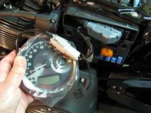 Connect new Speedo/Tach via connector cable, turn on bike IGN and RUN switches (motor does not need to be running) and ECM will transfer mileage/data to new Speedo/Tach.
