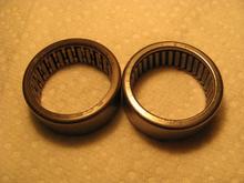 Side-by-side pic of old (left) and new cam bearings. Note number of needle rollers and cage.